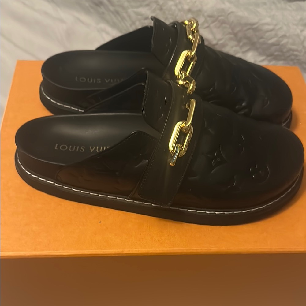 Louis Vuitton leather Black and Gold Mules with Elegant LV Design size 8.5